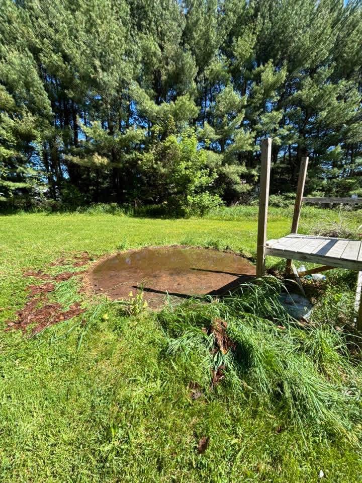 Above-ground pool removal, after: pool taken down and area cleared to bare ground